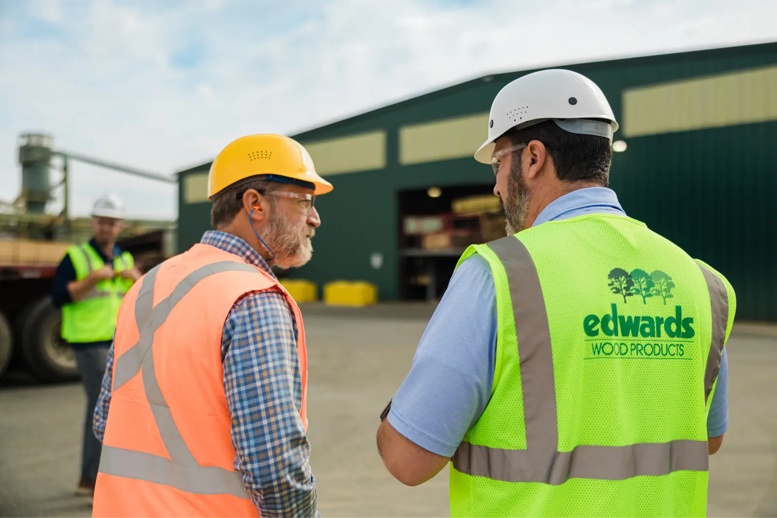 Josh Lee on a job site with clients